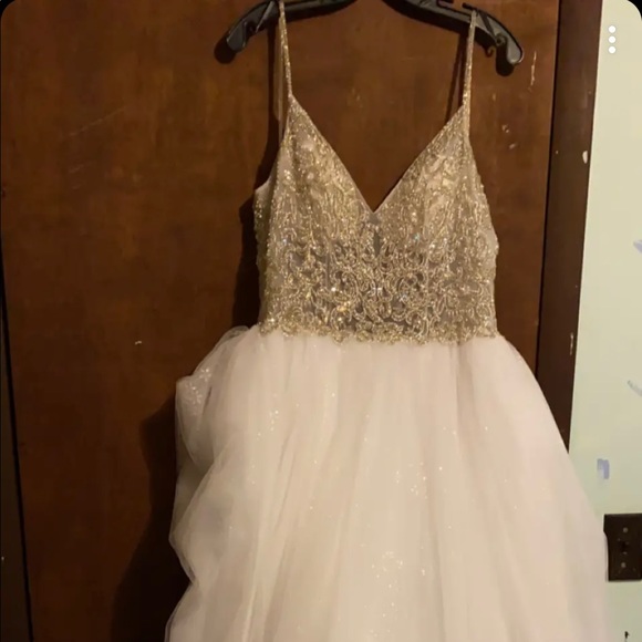 Size 12, Casablanca wedding gown, worn once, stored in a garment bag. $800 obo